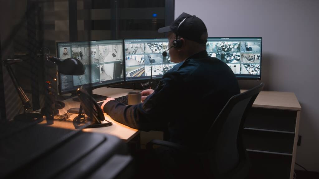 Security,Operator,In,Headset,Controls,Cctv,Cameras,In,Office,At
